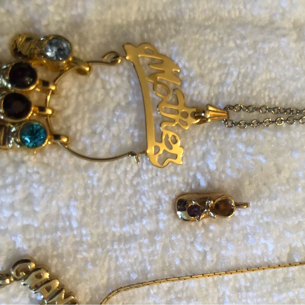 3 necklaces, baby shoes. Wear alone or with charms. Two mother, one grandmother